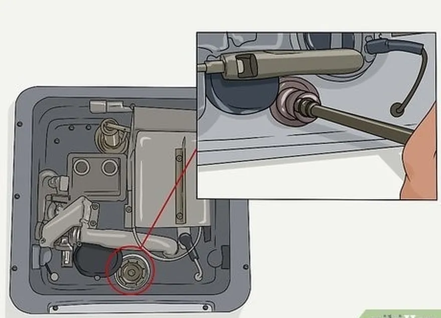 ステップ4タンクを外します's plug or anode rod with a socket wrench.